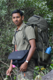 Bawa M. Krishnakumar  in front of large rocks.