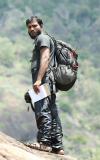 Kothandapani Raman climbing a steep hillside