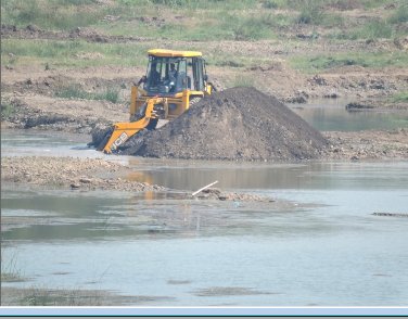 Mechanical digger heaping up sand and gravel for removal, eating into the bank and digging up sandbanks; fine silt is stirred up, clouding the river water and bankside vegetation has been beaten down by the passage of the machine. Click for larger version